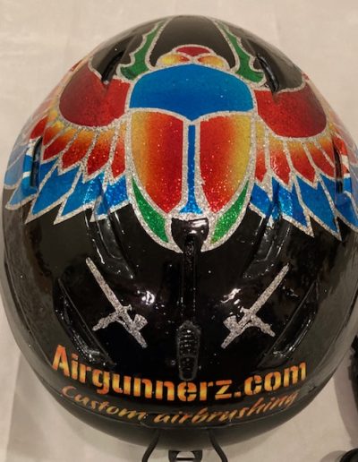 Top and back view of airbrushed ski helmet scarab design- airgunnerz.live-website.com custom airbrushing. Candies over metal flake